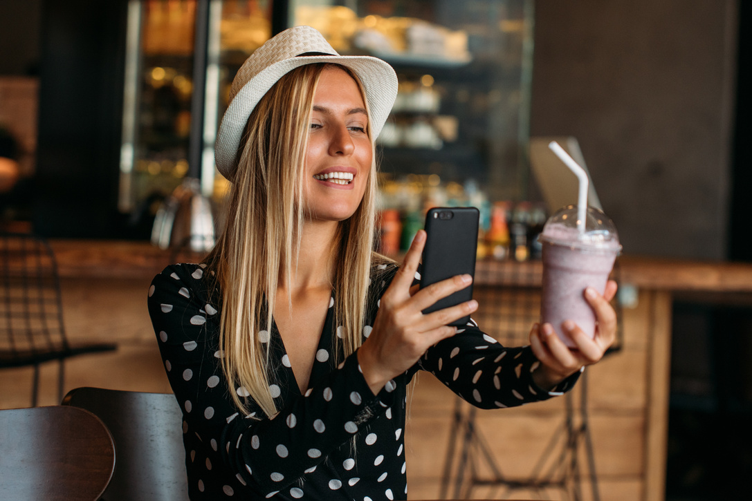 Blogger Woman Takes Milkshake Photo